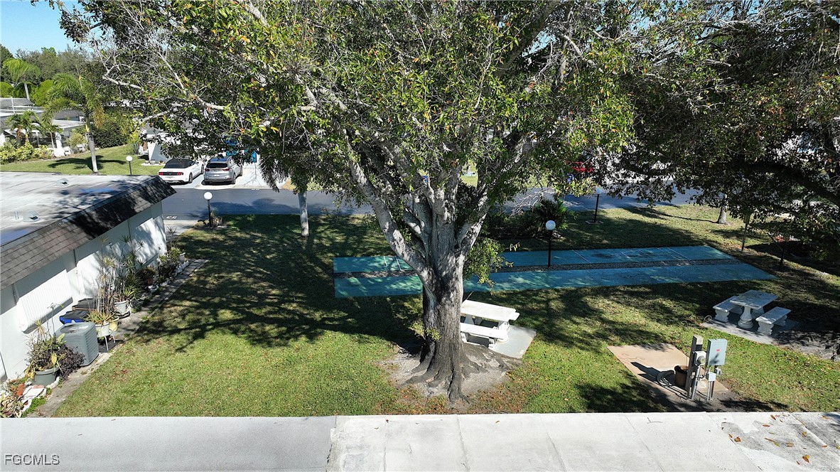 13 Hamlin Court Lehigh Acres, FL 33936 - Photo 25 of 31 a view of a park with large trees