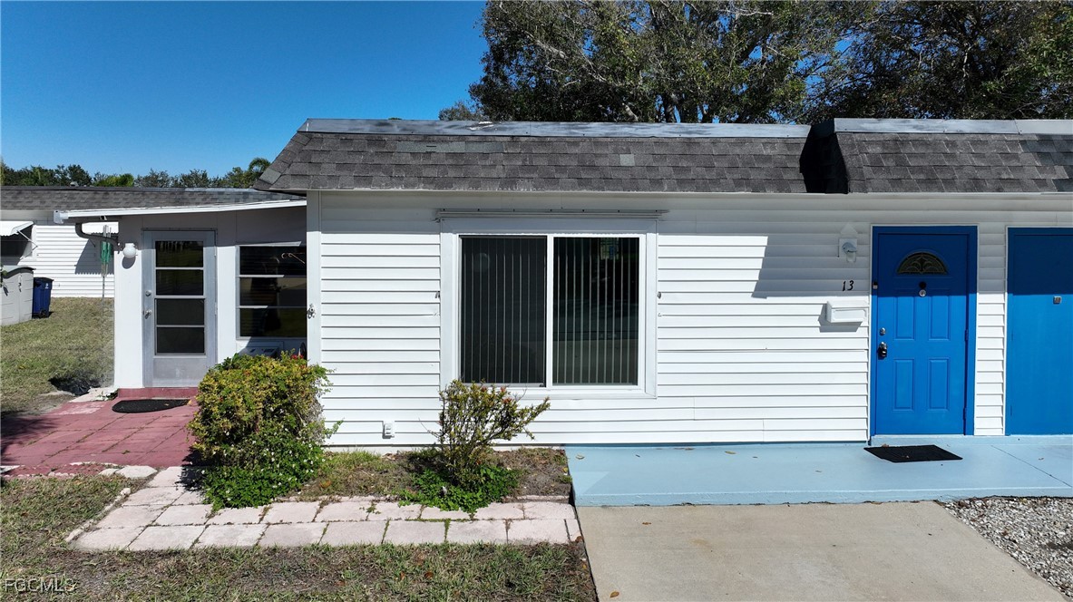 13 Hamlin Court Lehigh Acres, FL 33936 - Photo 26 of 31 a view of a house with a yard