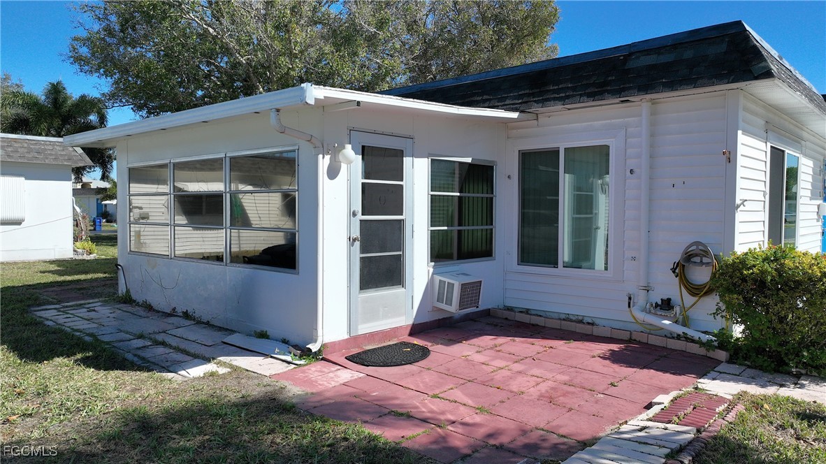 13 Hamlin Court Lehigh Acres, FL 33936 - Photo 27 of 31 a front view of a house with a yard