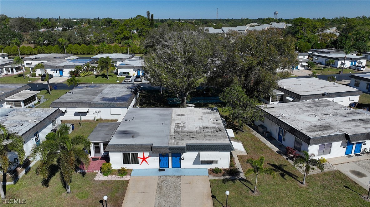 13 Hamlin Court Lehigh Acres, FL 33936 - Photo 28 of 31 an aerial view of residential houses with outdoor space