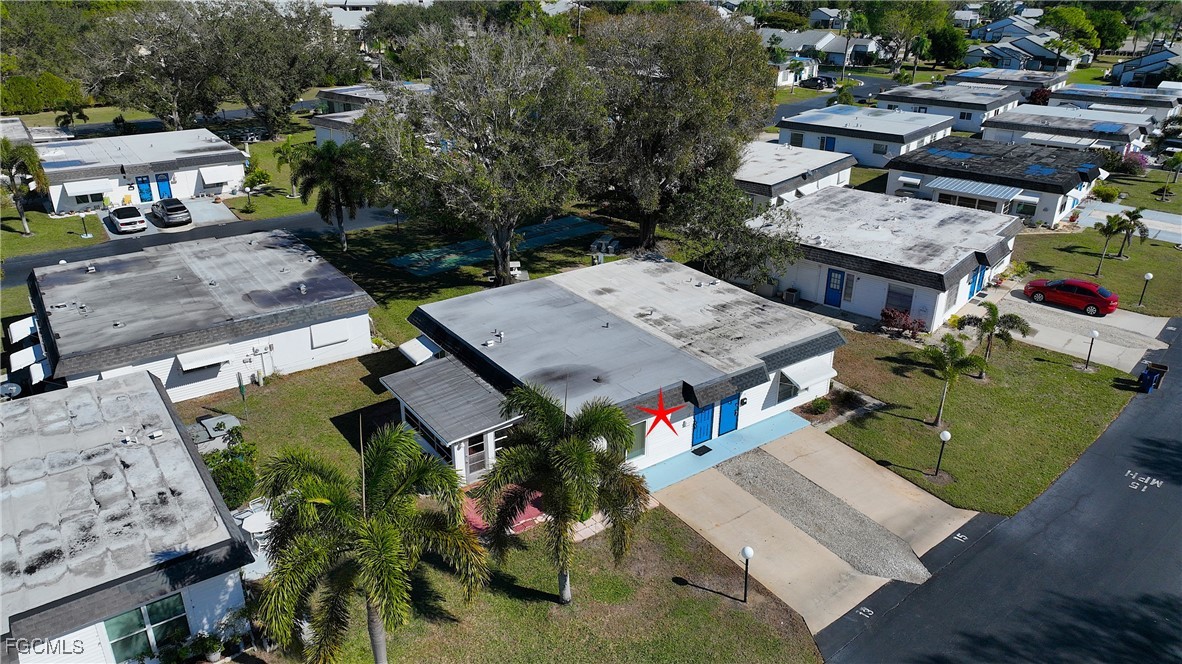 13 Hamlin Court Lehigh Acres, FL 33936 - Photo 3 of 31 an aerial view of a house with a garden