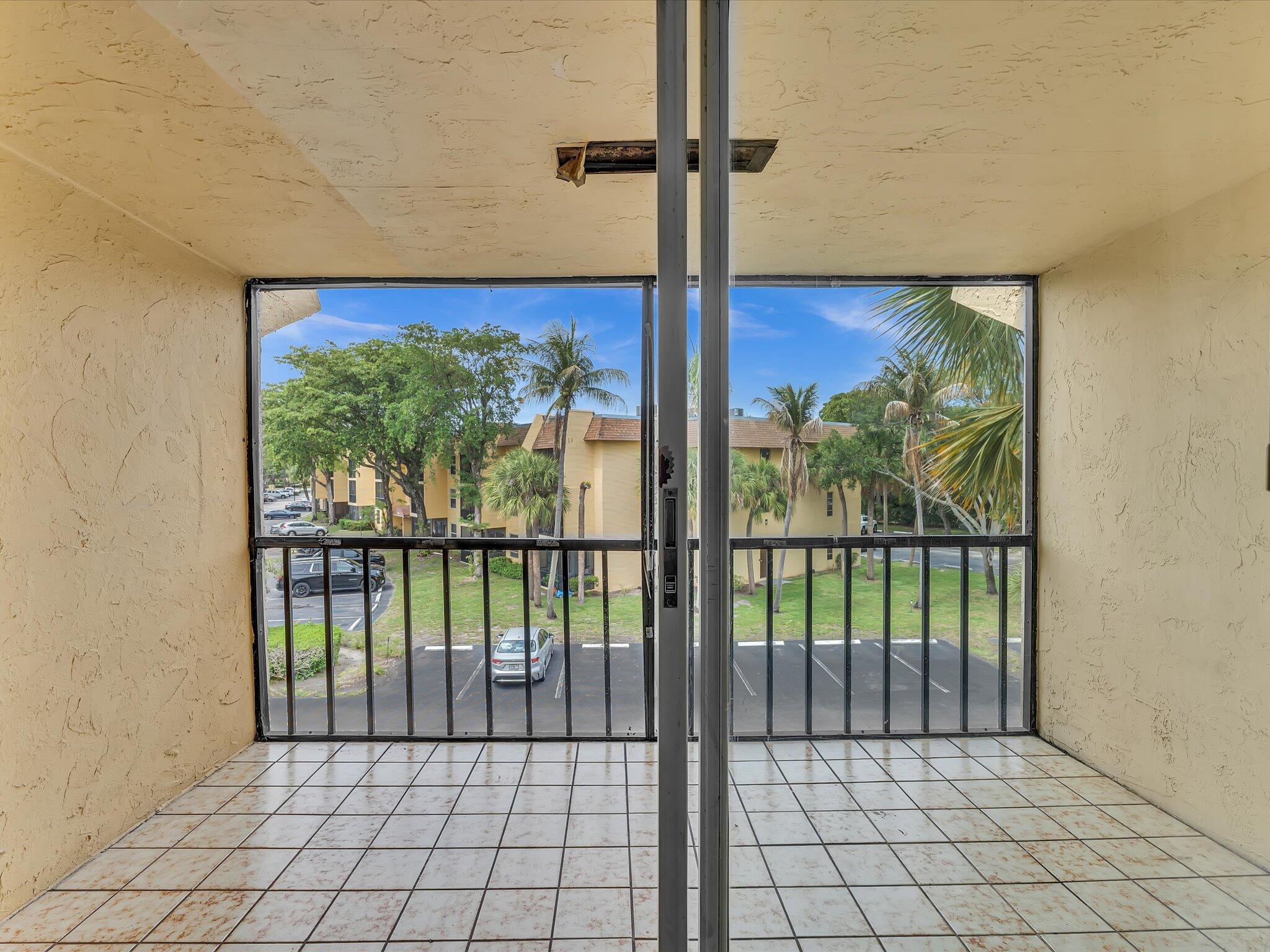 470 Northwest 20th Street, Unit 3020 Boca Raton, FL 33431 - Photo 32 of 43 Sliding Doors to Balcony