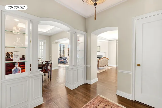a kitchen with white cabinets and appliances