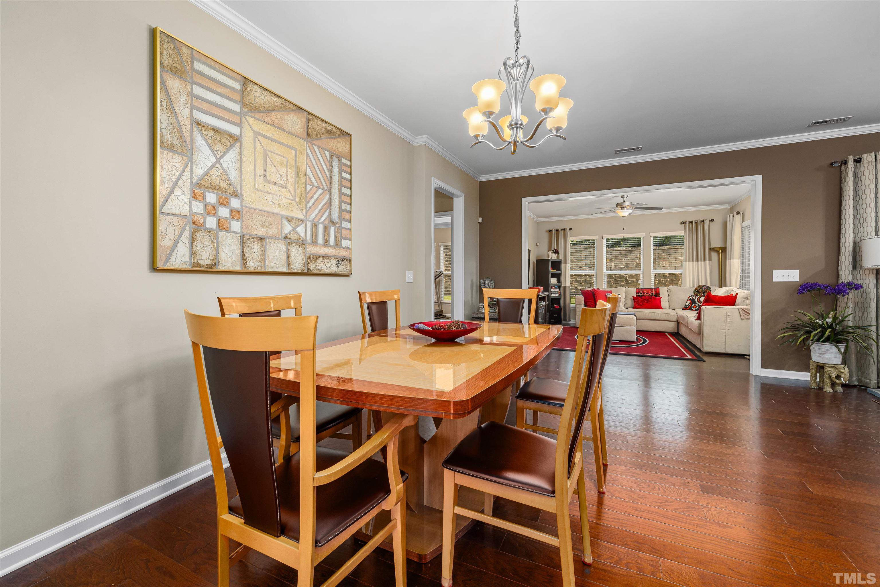 1115 Hooper Place Durham, NC 27703 - Photo 12 of 40 a view of a dining room with furniture and wooden floor