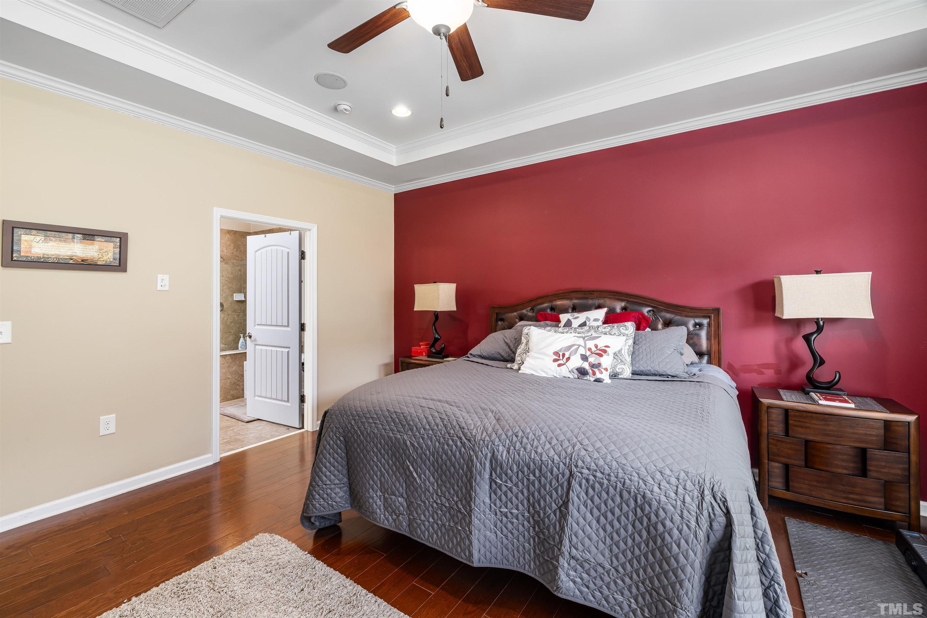 1115 Hooper Place Durham, NC 27703 - Photo 14 of 40 a bedroom with a bed and a lamp