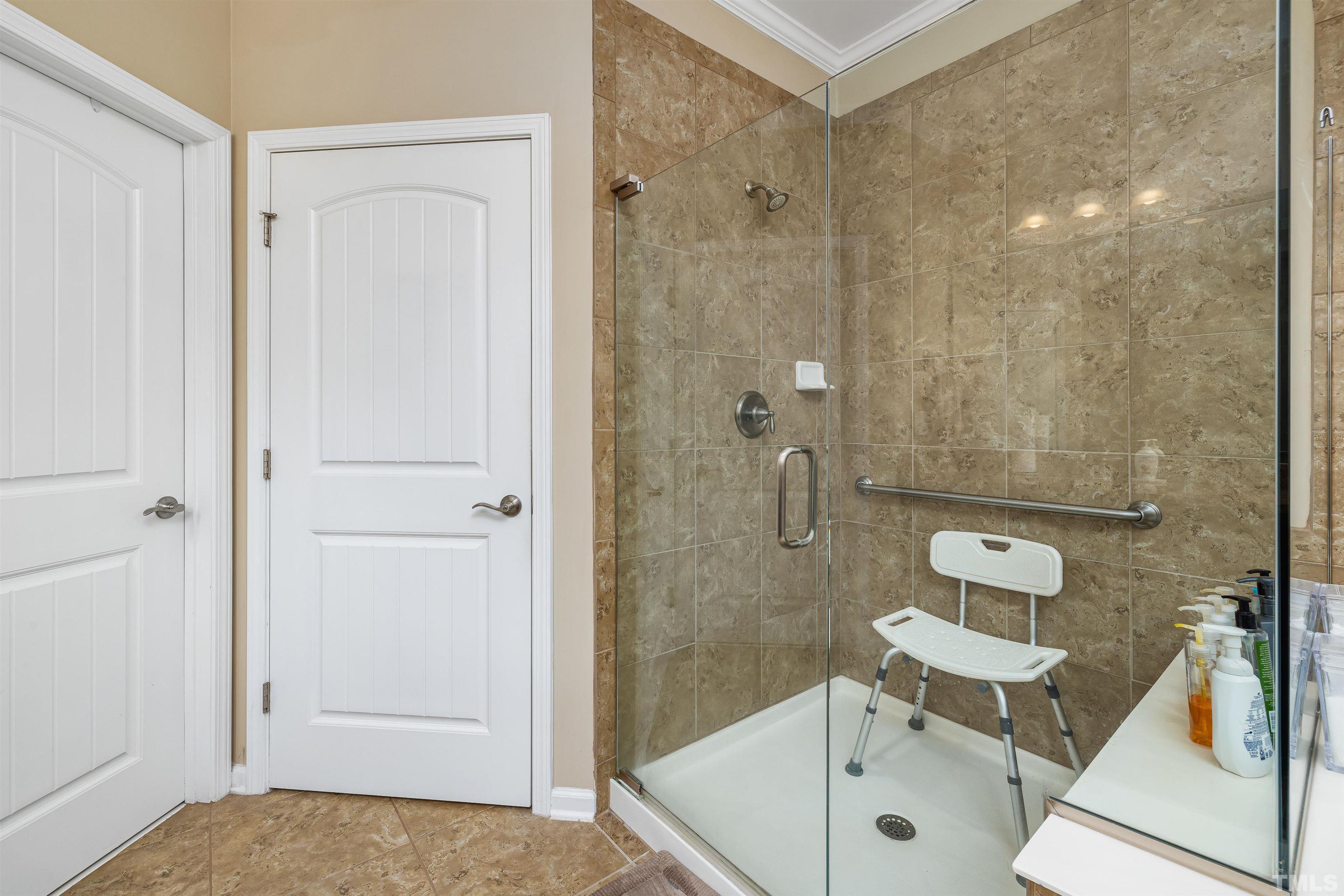 1115 Hooper Place Durham, NC 27703 - Photo 18 of 40 a bathroom with a sink a toilet and shower