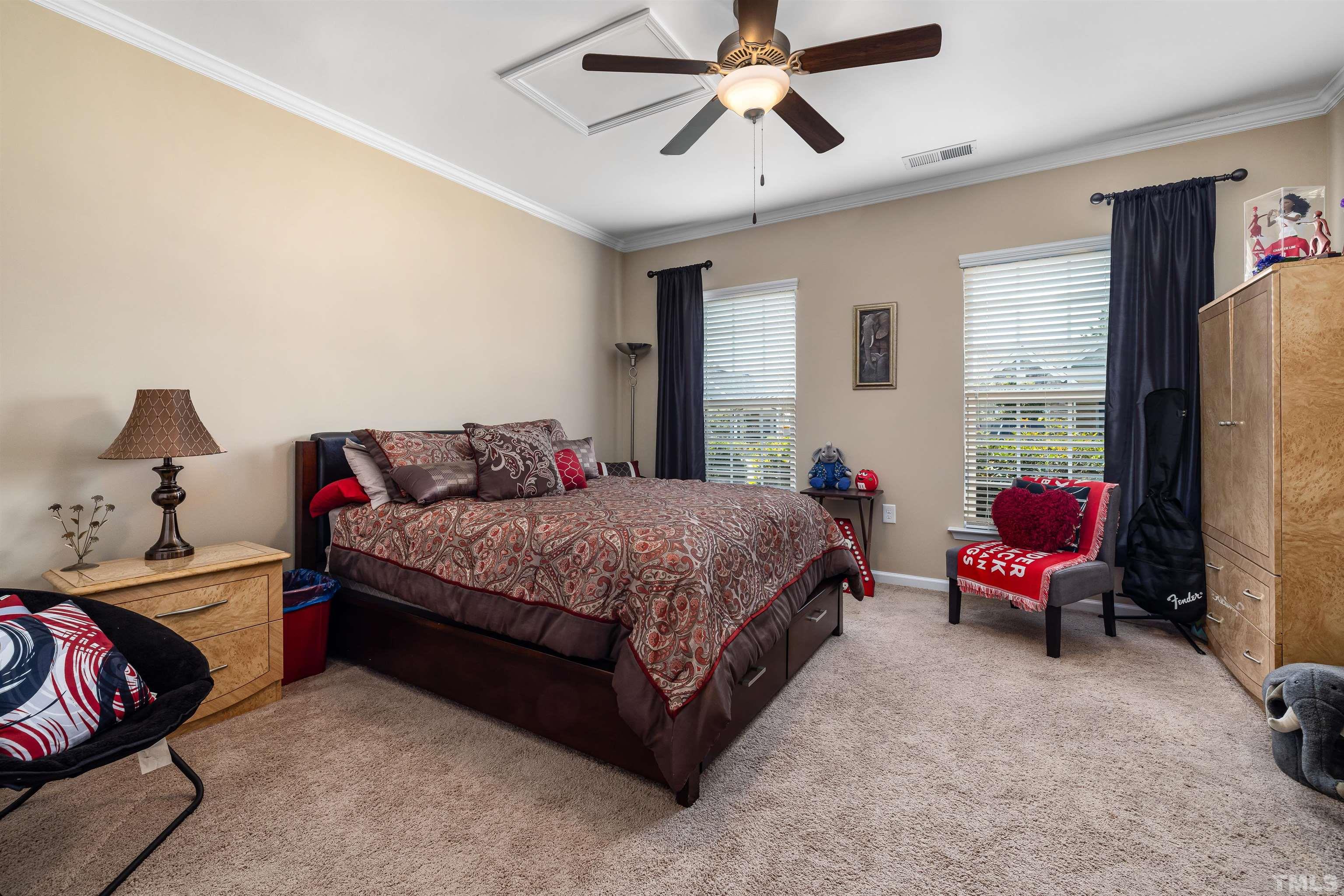 1115 Hooper Place Durham, NC 27703 - Photo 20 of 40 a bedroom with a bed and furniture