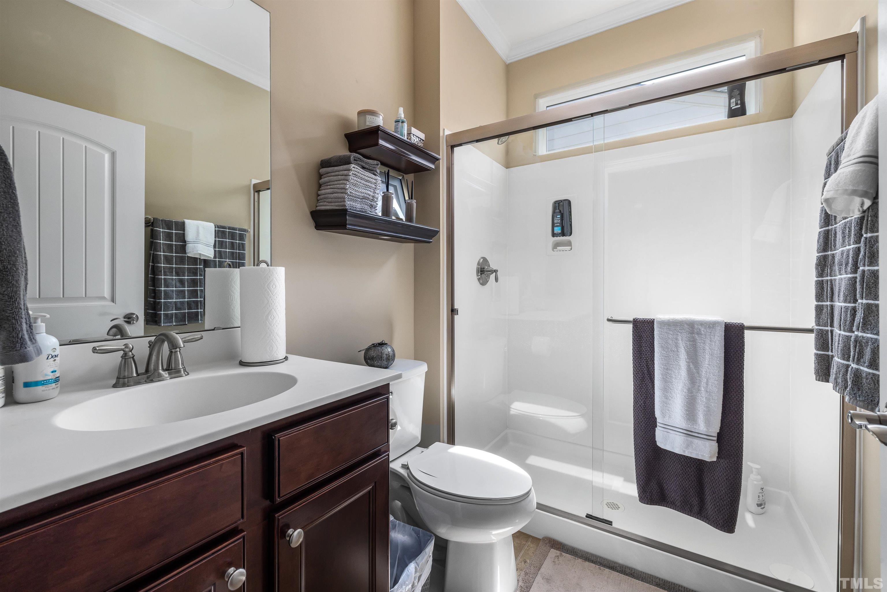 1115 Hooper Place Durham, NC 27703 - Photo 21 of 40 a bathroom with a sink toilet and shower