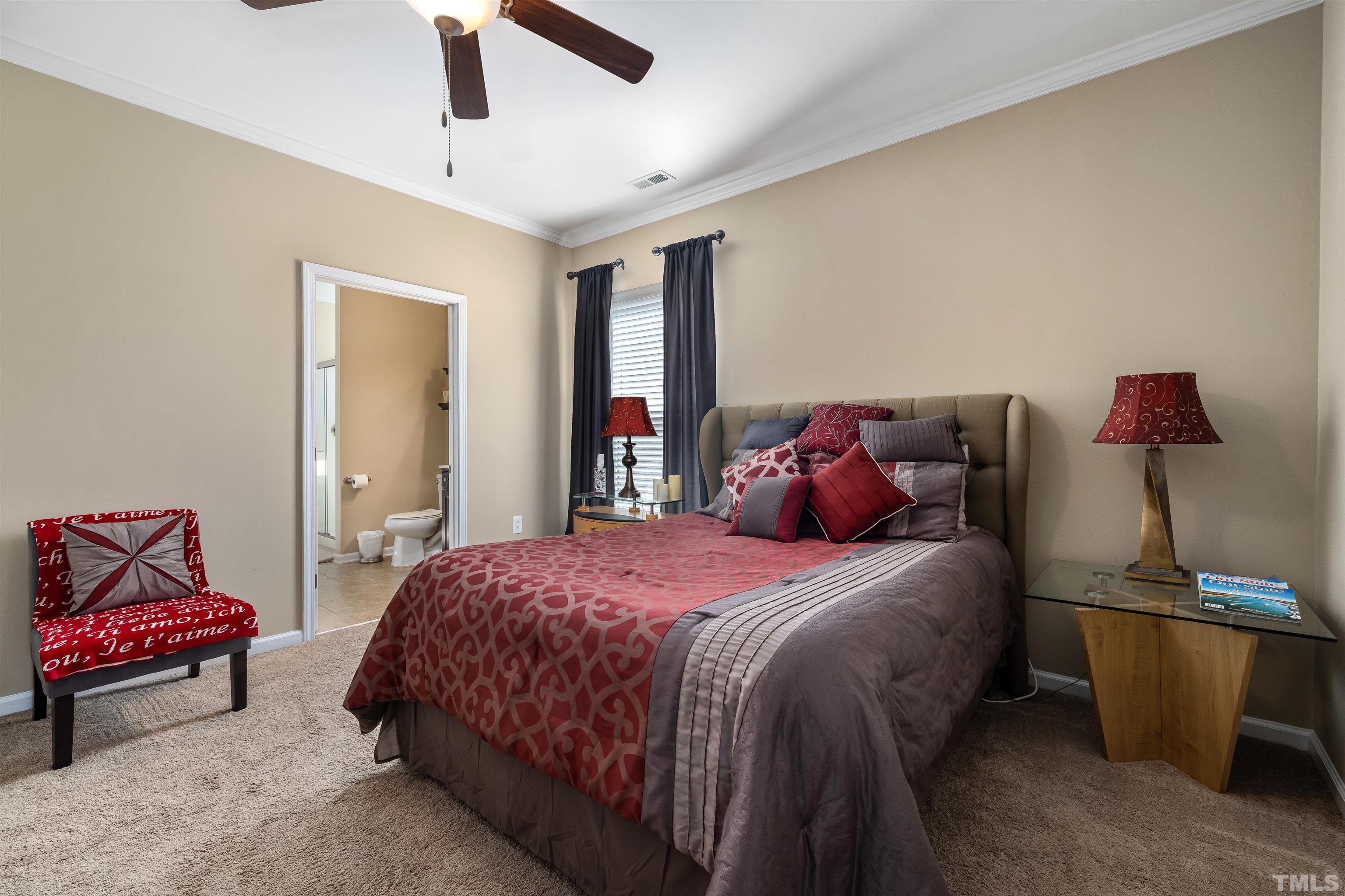 1115 Hooper Place Durham, NC 27703 - Photo 22 of 40 a bedroom with a bed and wooden floor