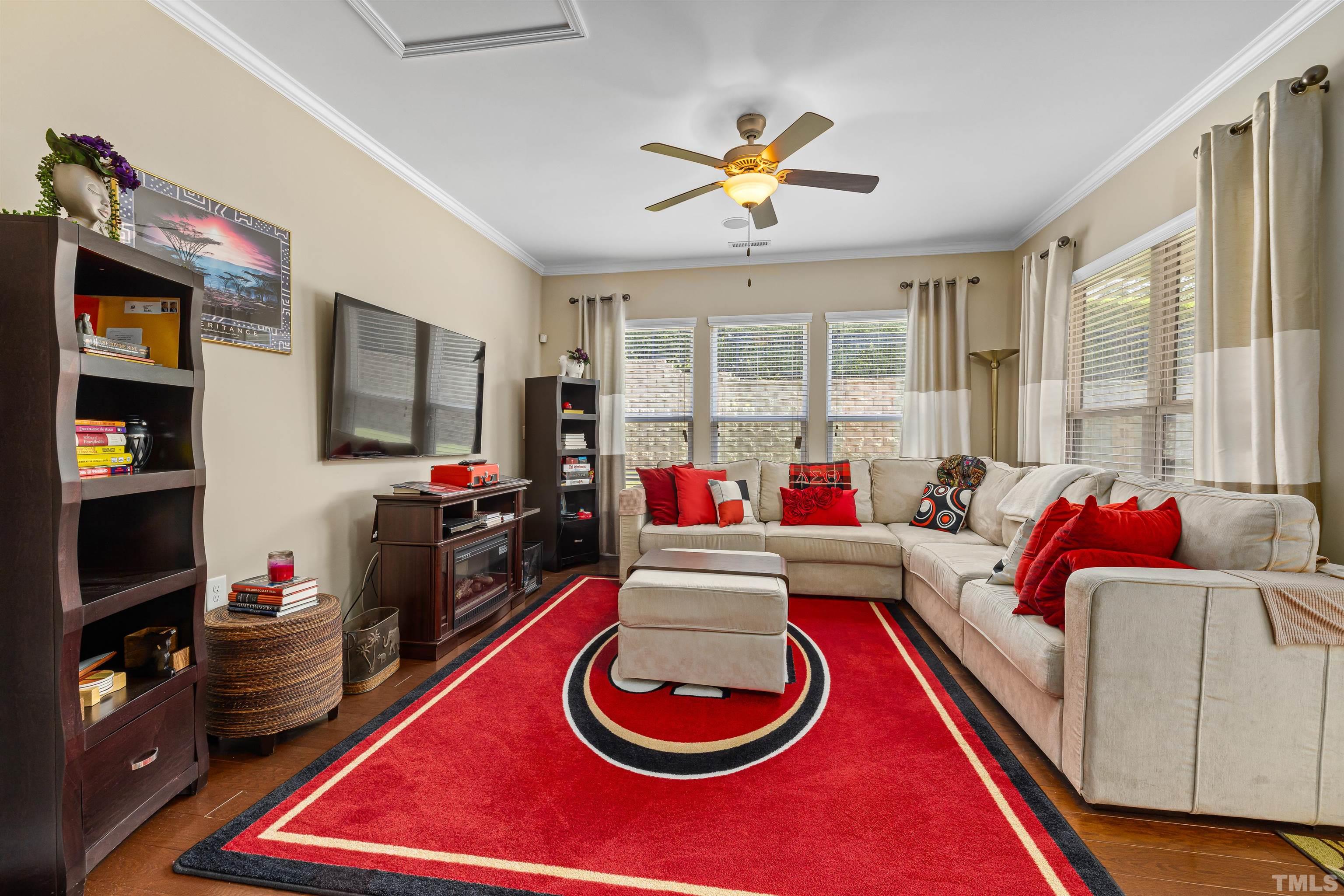 1115 Hooper Place Durham, NC 27703 - Photo 26 of 40 a living room with furniture and a flat screen tv