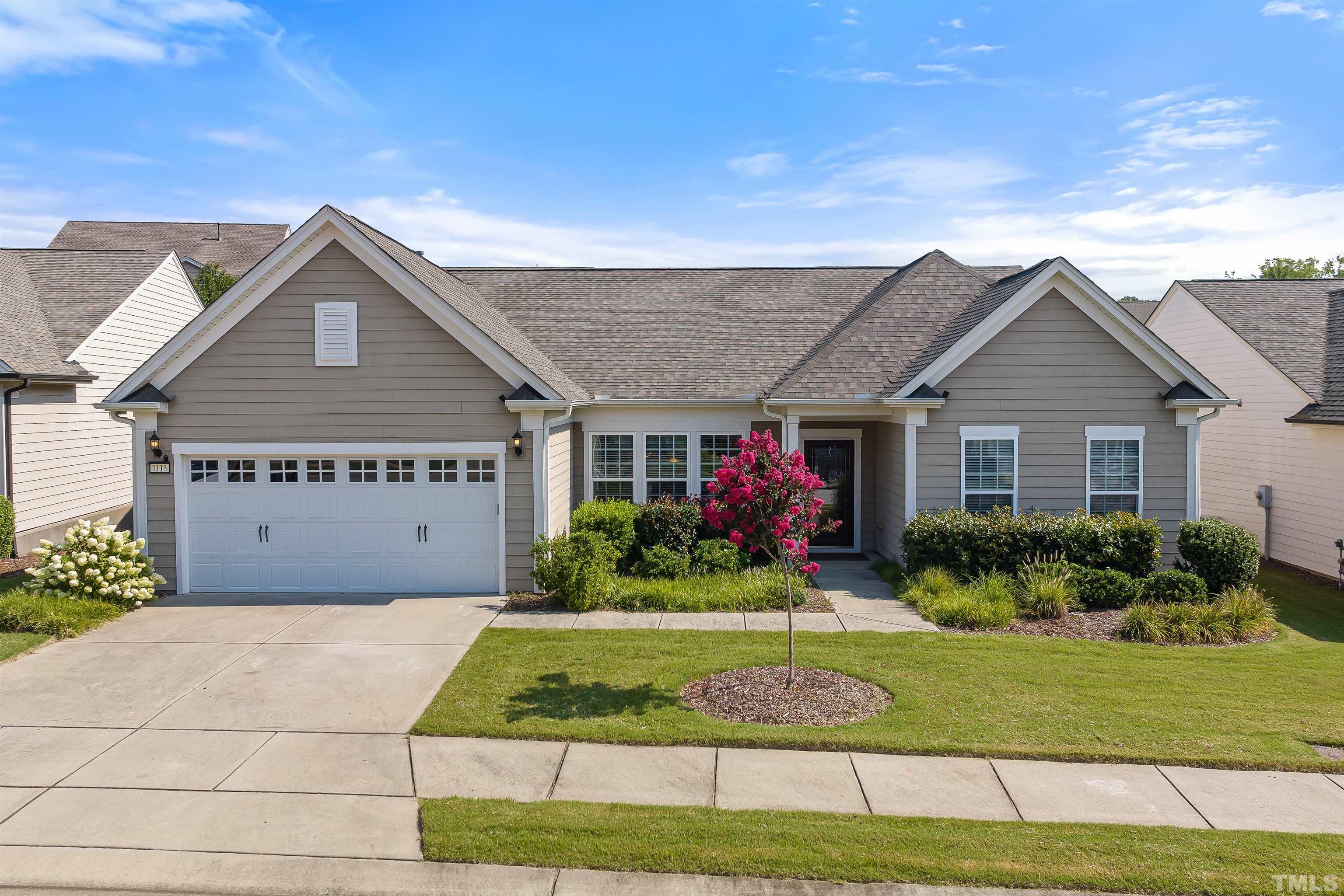 1115 Hooper Place Durham, NC 27703 - Photo 33 of 40 a front view of a house with a yard and garage
