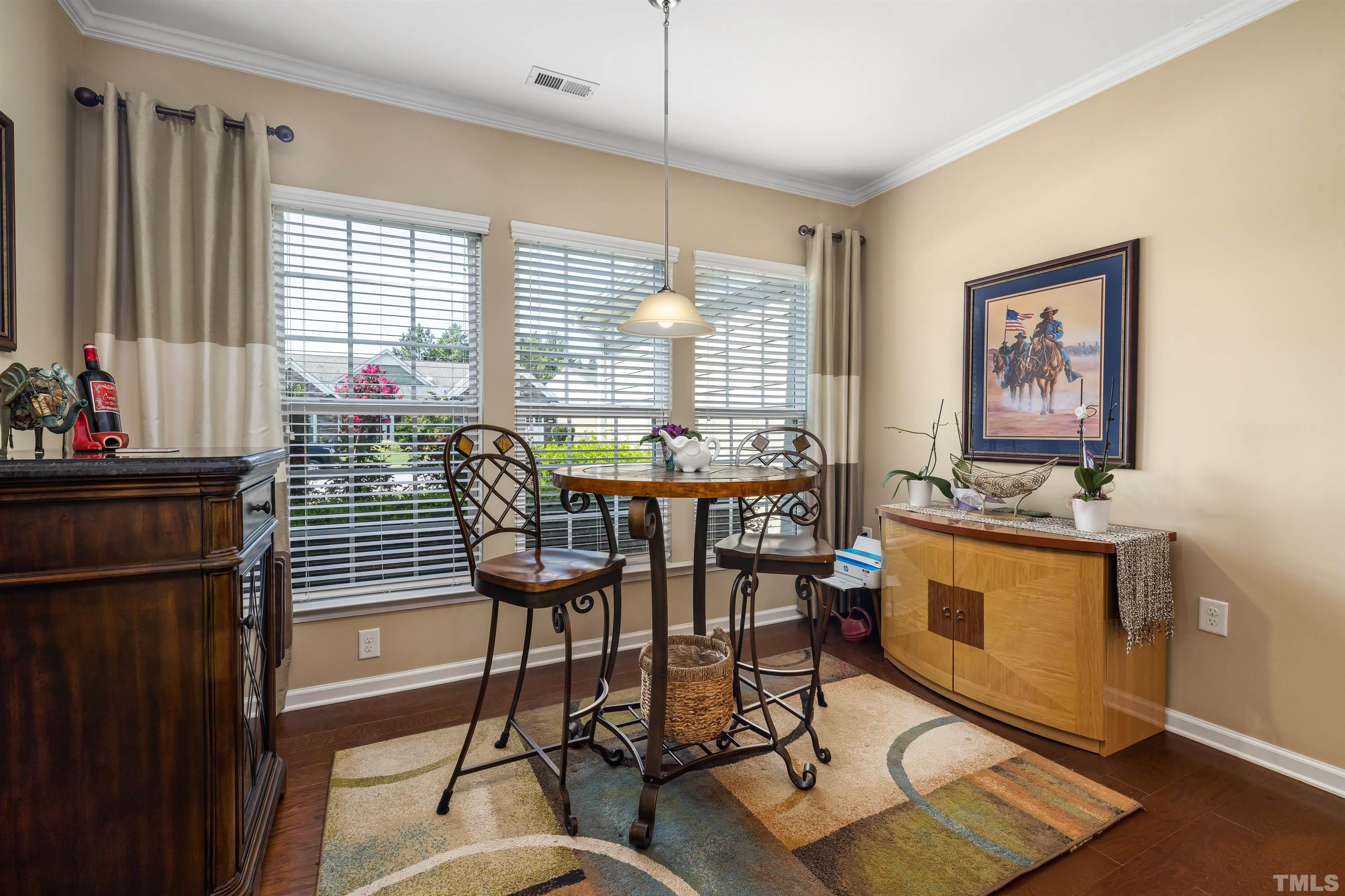 1115 Hooper Place Durham, NC 27703 - Photo 4 of 40 a view of a dining room with furniture window and outside view