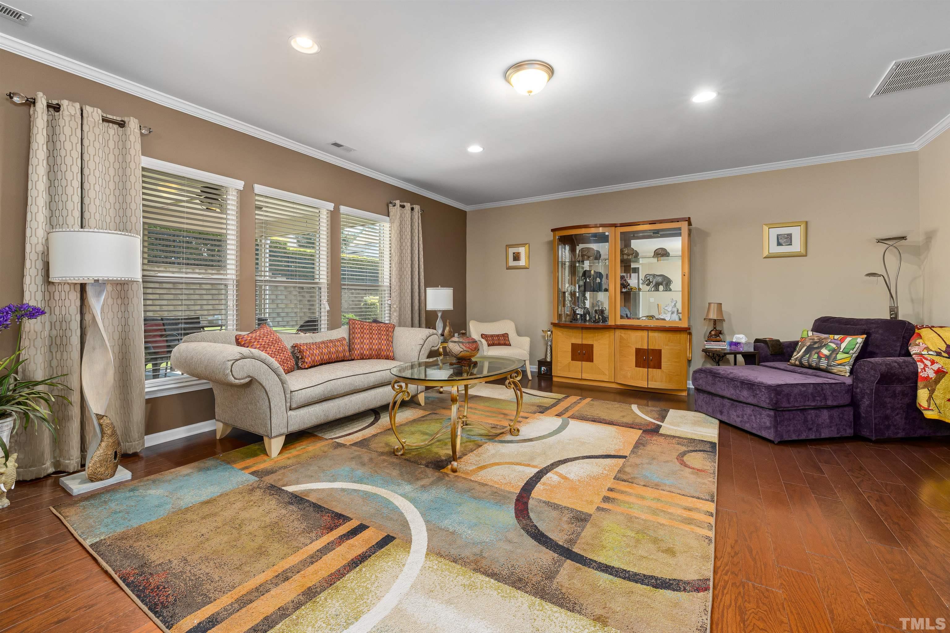 1115 Hooper Place Durham, NC 27703 - Photo 10 of 40 a living room with furniture and a floor to ceiling window