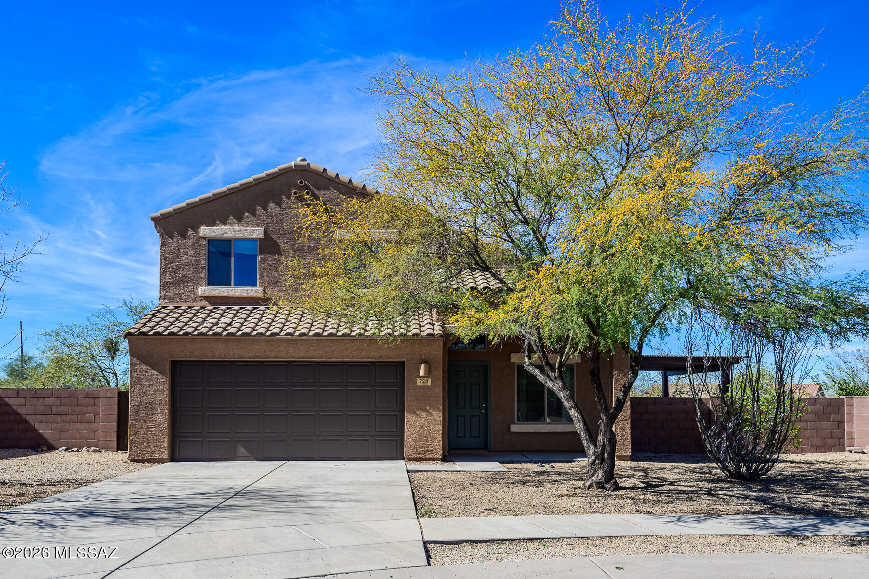 728 South Porter Routh Place Vail, AZ 85641 - Photo 1 of 36 a front view of a house with a yard
