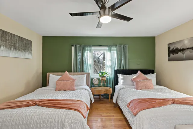 a bedroom with a large bed and a large window