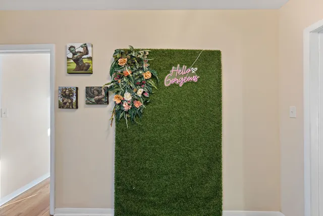 a bathroom with a sink mirror and a shower