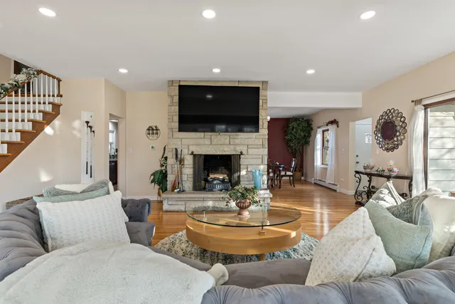a living room with furniture fireplace and a flat screen tv