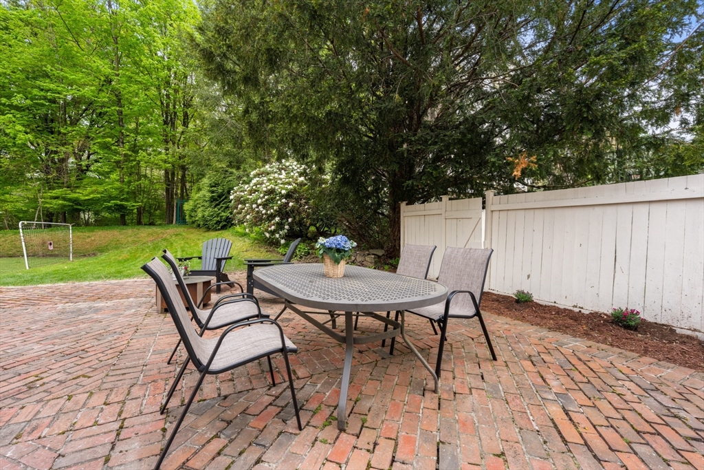 41 Longmeadow Road Wellesley, MA 02482 - Photo 36 of 41 a view of a chairs and table in backyard