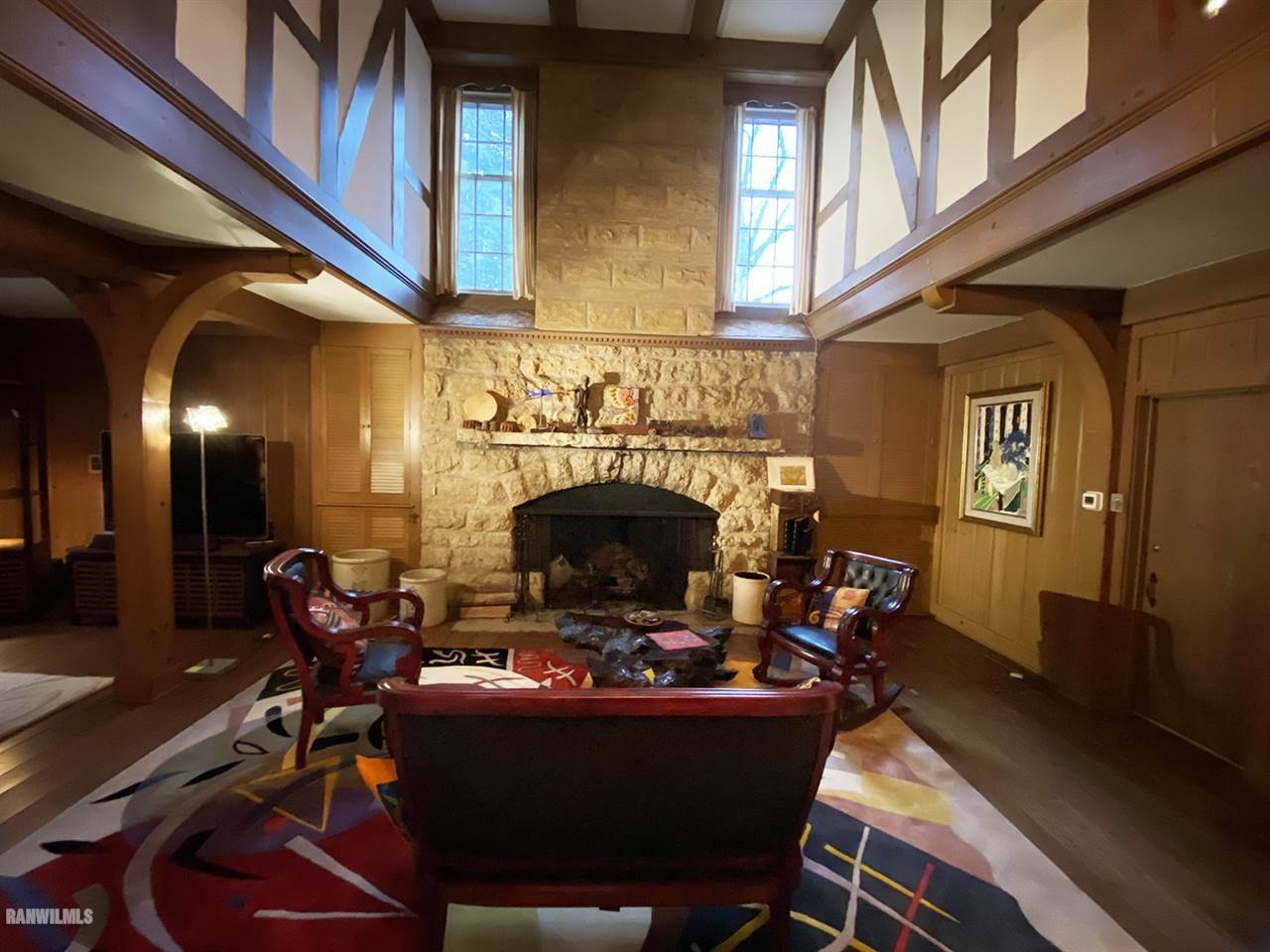 2871 West Forest Road Freeport, IL 61032 - Photo 22 of 68 a view of a livingroom with furniture a fireplace window and chair