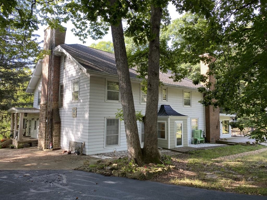 2871 West Forest Road Freeport, IL 61032 - Photo 3 of 68 a front view of a house with a yard and garage