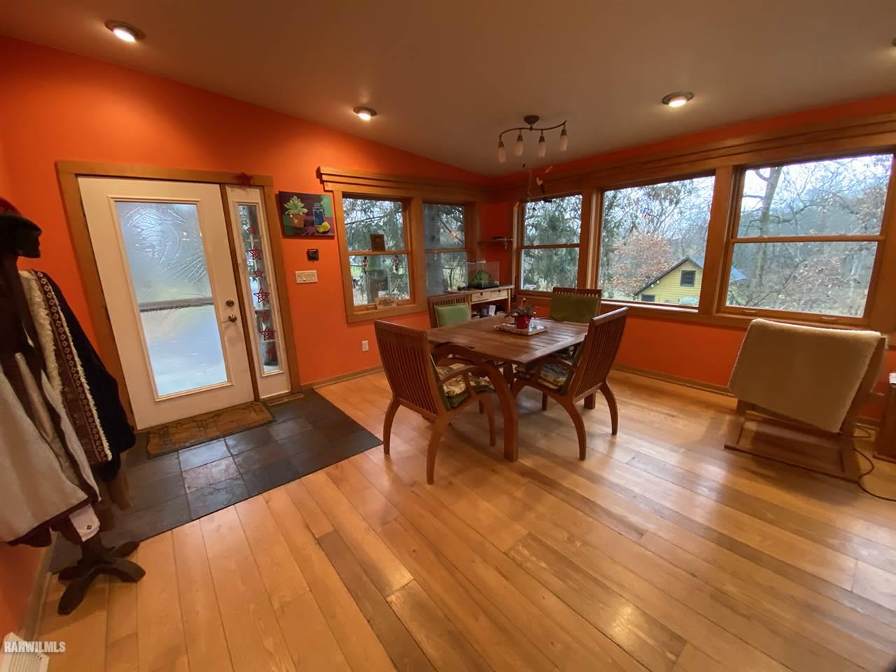 2871 West Forest Road Freeport, IL 61032 - Photo 36 of 68 a dining room with furniture and wooden floor