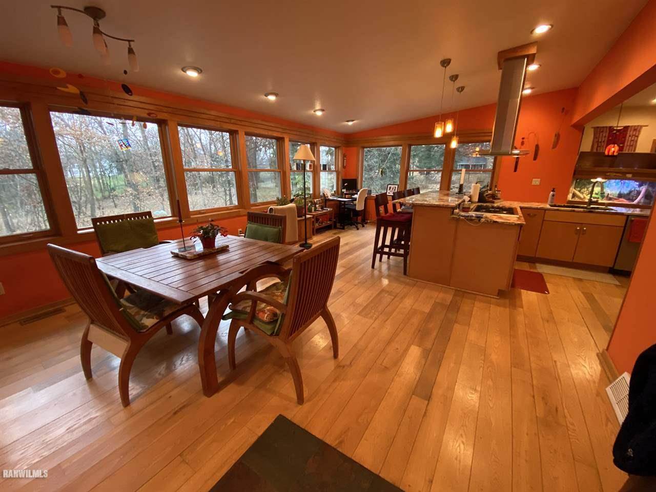 2871 West Forest Road Freeport, IL 61032 - Photo 37 of 68 a view of a dining room with furniture window and wooden floor