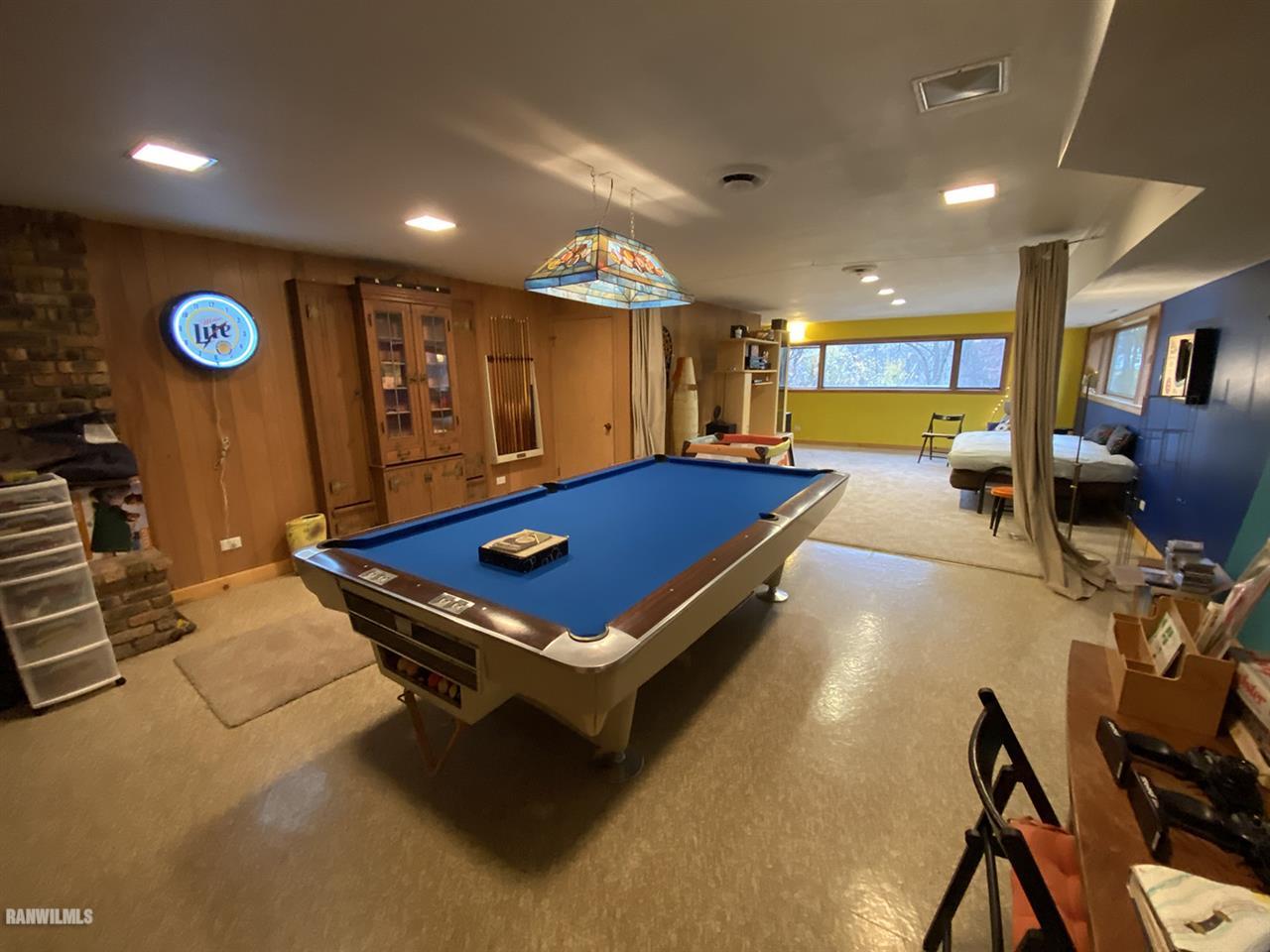 2871 West Forest Road Freeport, IL 61032 - Photo 44 of 68 a pool table sitting in the middle of a room
