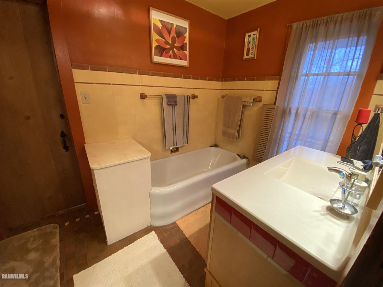 2871 West Forest Road Freeport, IL 61032 - Photo 47 of 68 a bathroom with a sink and a tub