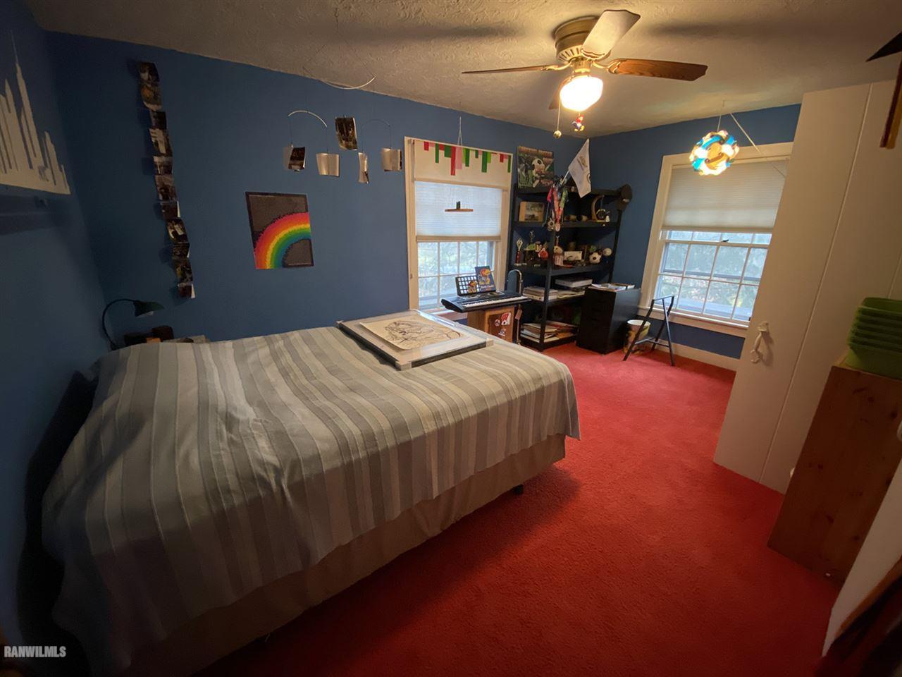 2871 West Forest Road Freeport, IL 61032 - Photo 50 of 68 a bed sitting in a spacious bedroom next to a window