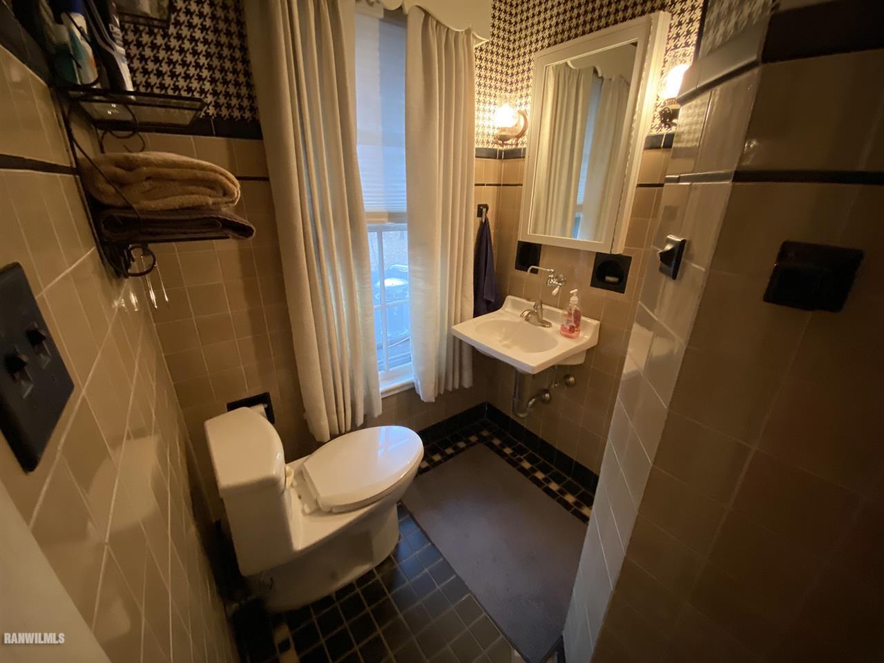 2871 West Forest Road Freeport, IL 61032 - Photo 52 of 68 a bathroom with a sink toilet and shower