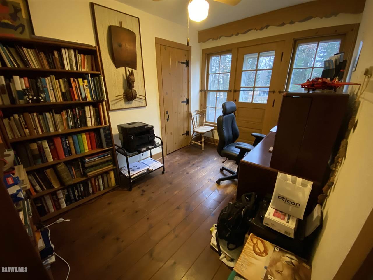 2871 West Forest Road Freeport, IL 61032 - Photo 54 of 68 a living room with fireplace furniture and a book shelf