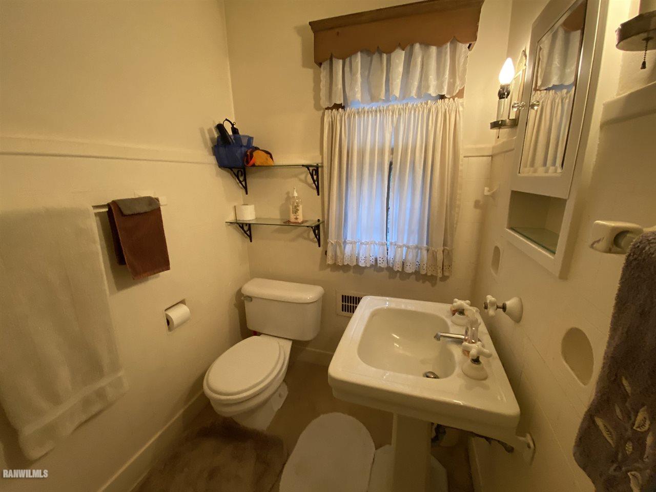 2871 West Forest Road Freeport, IL 61032 - Photo 56 of 68 a bathroom with a sink toilet and shower