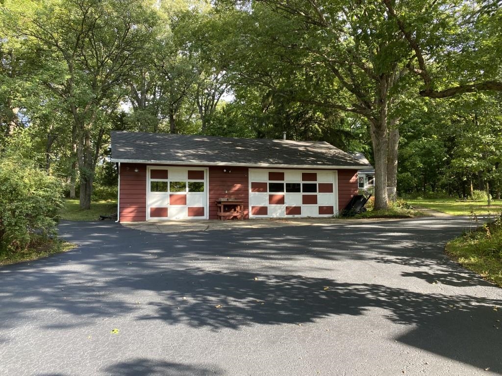 2871 West Forest Road Freeport, IL 61032 - Photo 6 of 68 a front view of a house with a garden