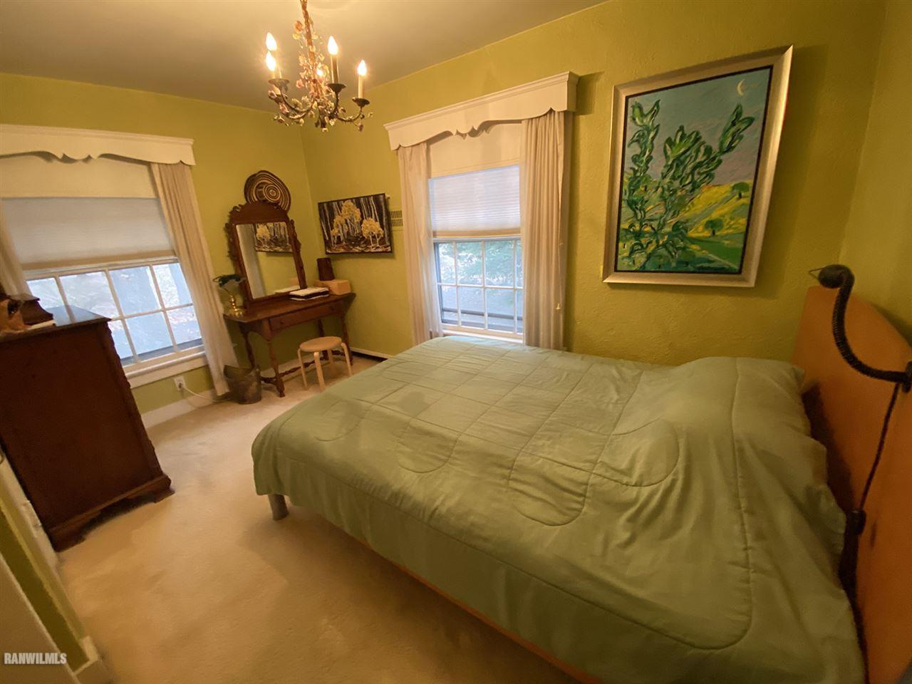 2871 West Forest Road Freeport, IL 61032 - Photo 64 of 68 a bedroom with a bed and a chair