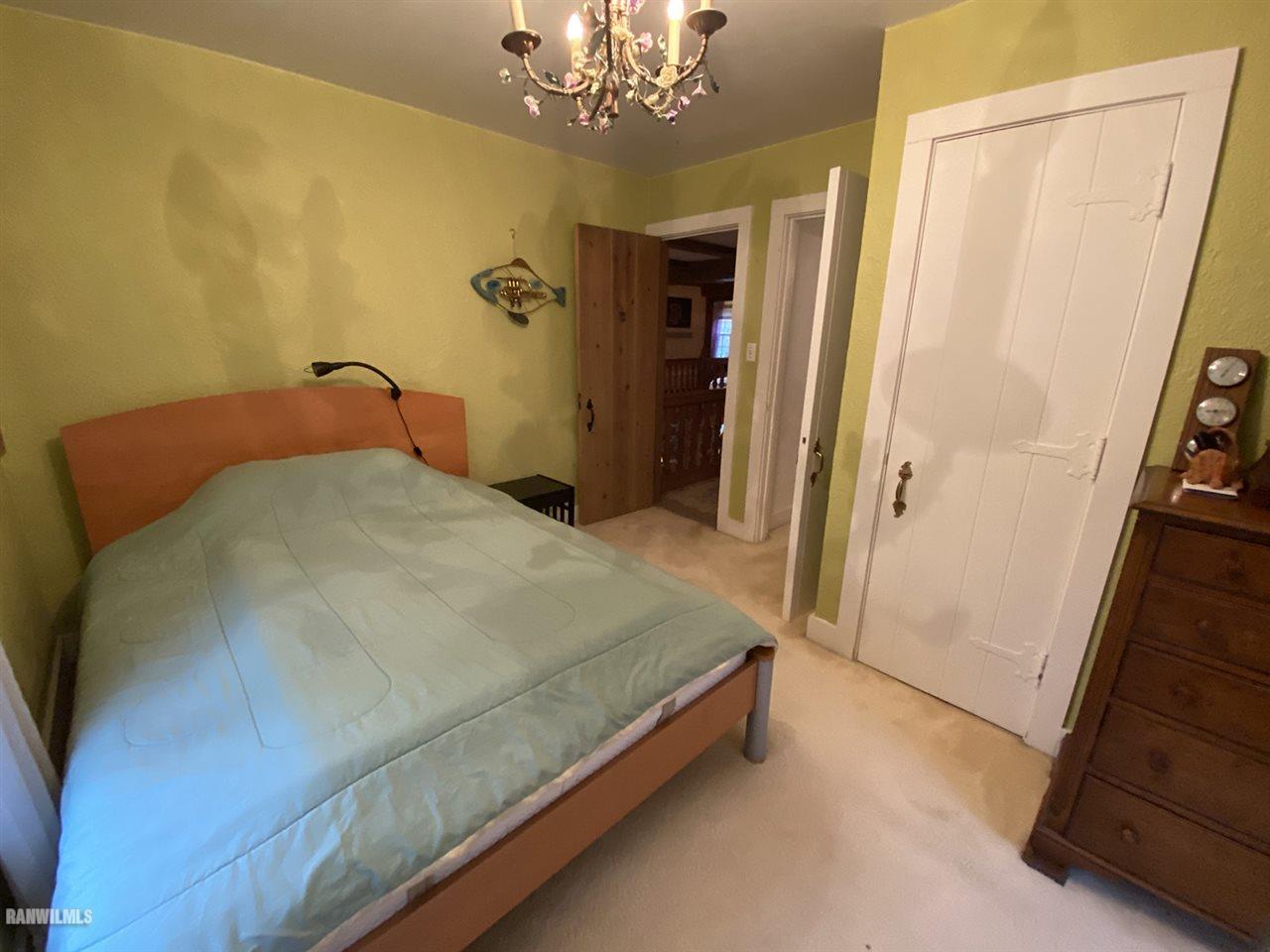 2871 West Forest Road Freeport, IL 61032 - Photo 65 of 68 a spacious bedroom with a bed and a mirror