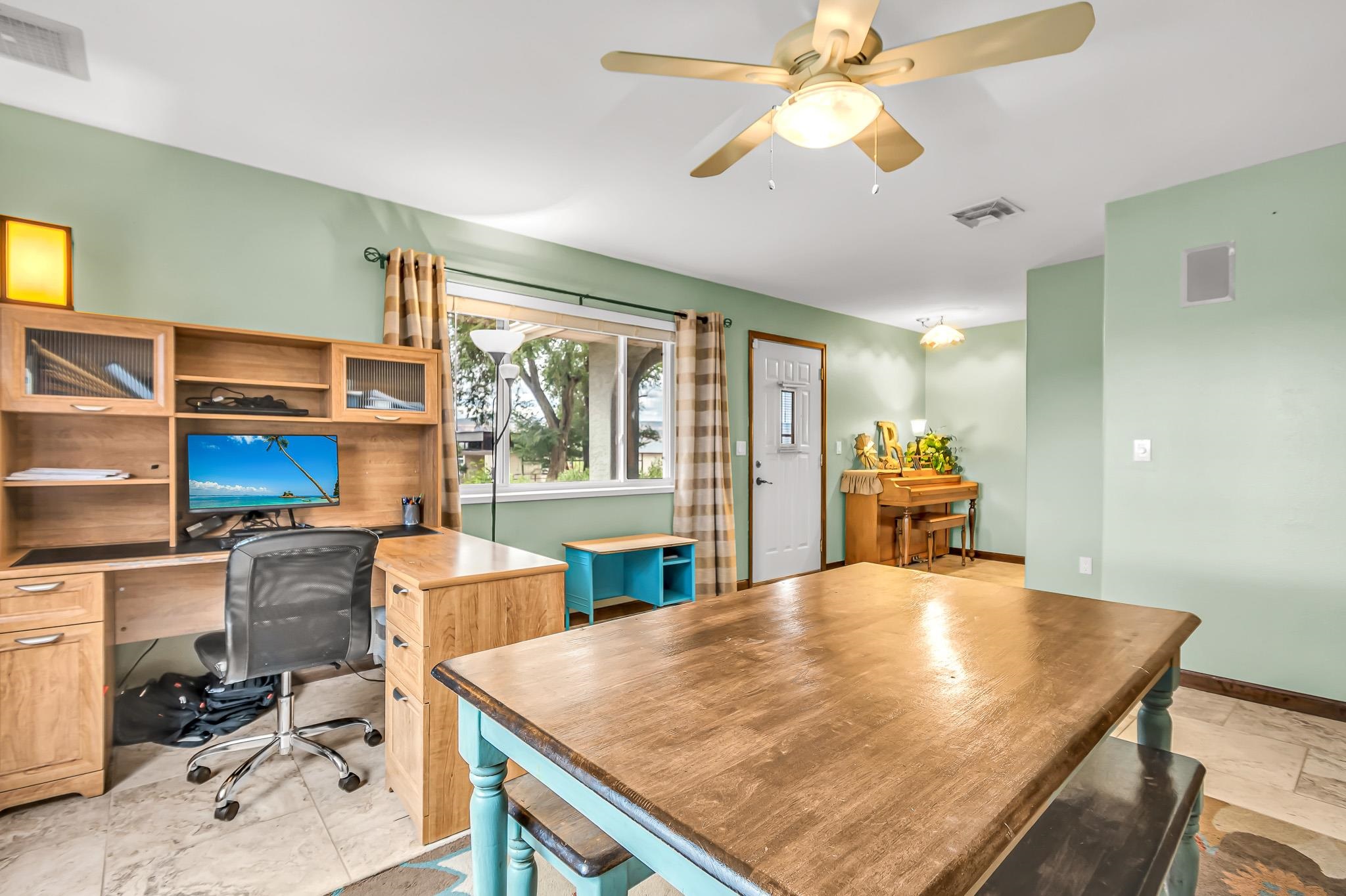 1171 20 Road Fruita, CO 81521 - Photo 12 of 42 a kitchen with a table chairs and entryway