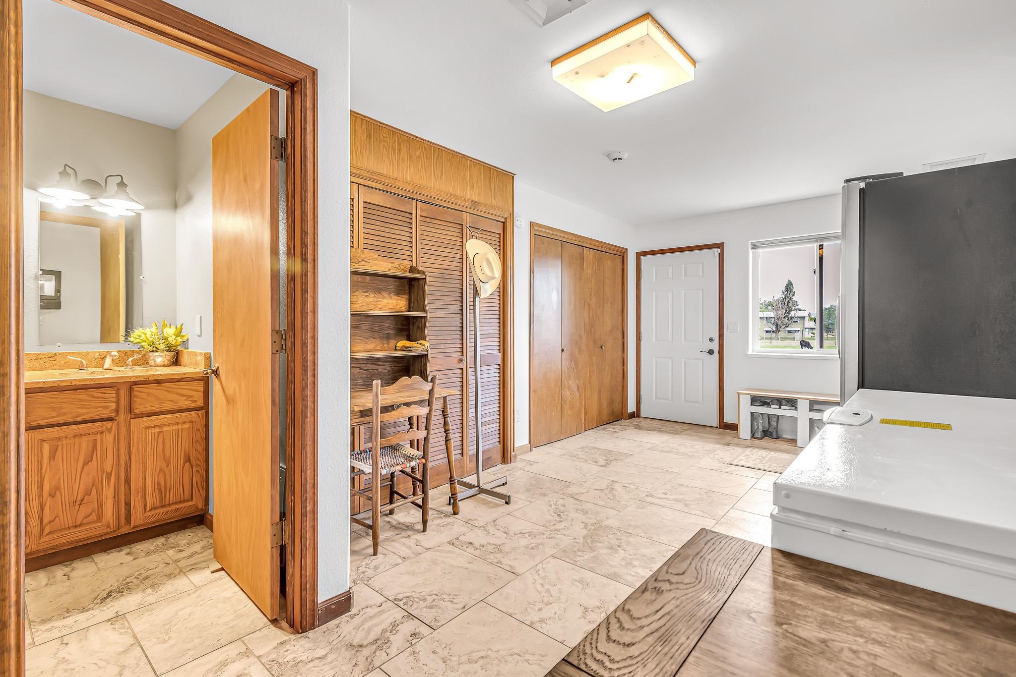 1171 20 Road Fruita, CO 81521 - Photo 13 of 42 a bedroom with a bed and a view of bathroom