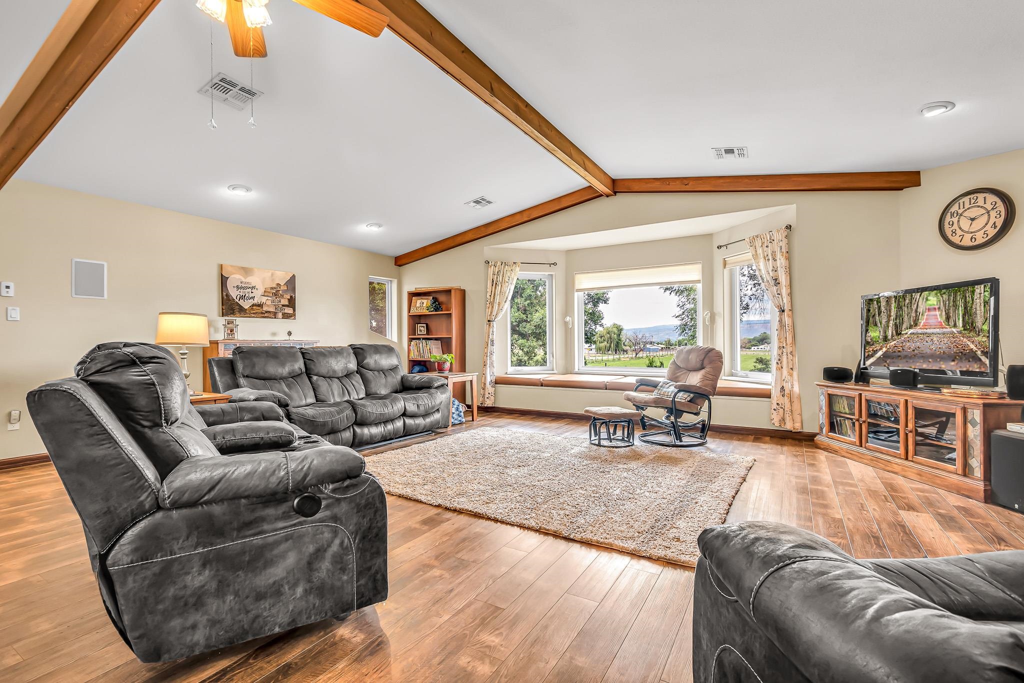 1171 20 Road Fruita, CO 81521 - Photo 5 of 42 a living room with furniture and a large window