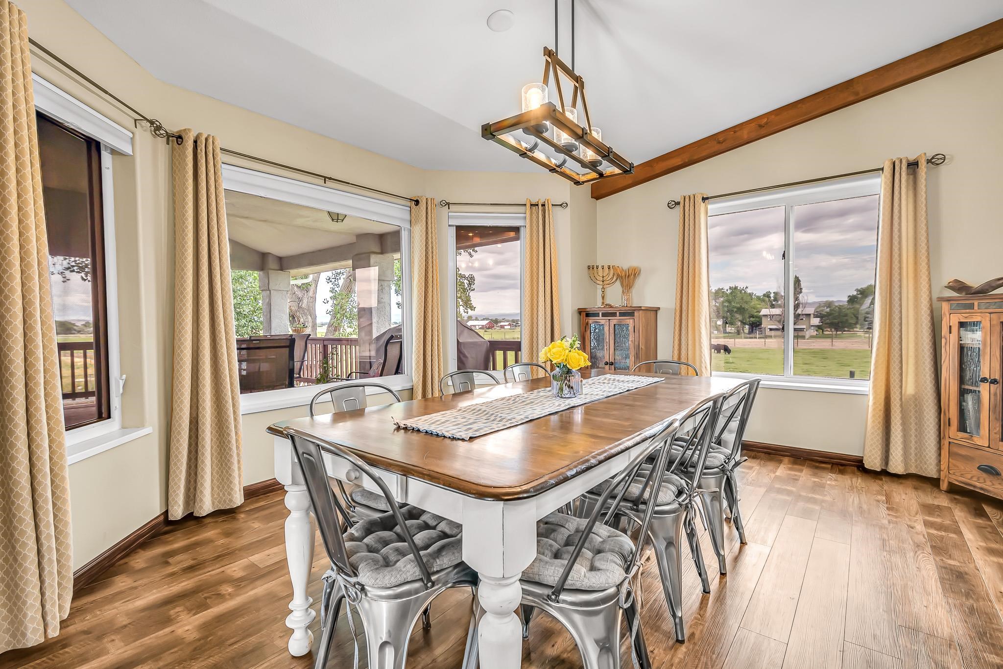 1171 20 Road Fruita, CO 81521 - Photo 10 of 42 a view of a dining room with furniture wooden floor and chandelier