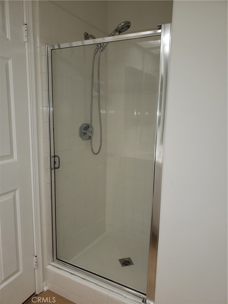 2345 Tryall Tustin, CA 92782 - Photo 20 of 29 a bathroom with a glass shower door