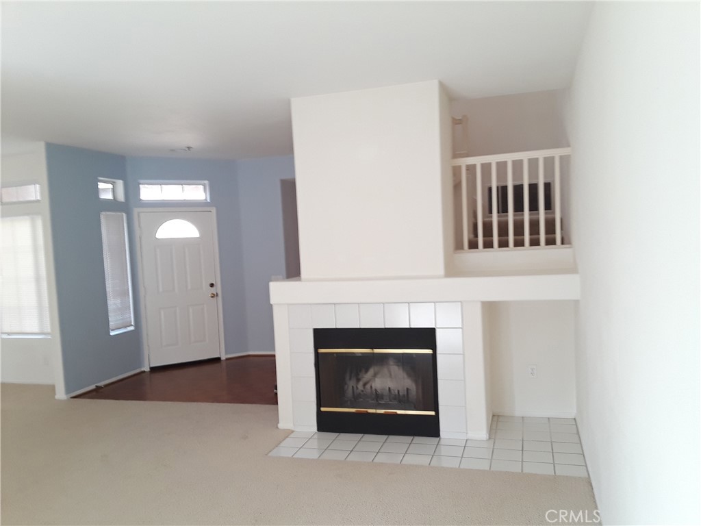2345 Tryall Tustin, CA 92782 - Photo 3 of 29 a living room with furniture and a fireplace