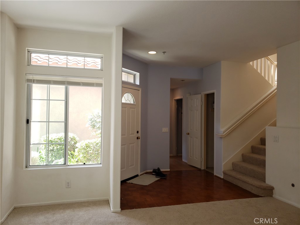 2345 Tryall Tustin, CA 92782 - Photo 5 of 29 a view of an empty room with wooden floor and a window