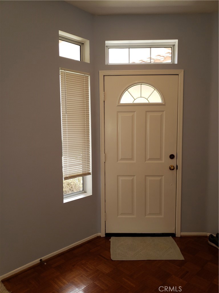 2345 Tryall Tustin, CA 92782 - Photo 6 of 29 an empty room with wooden floor fan and windows