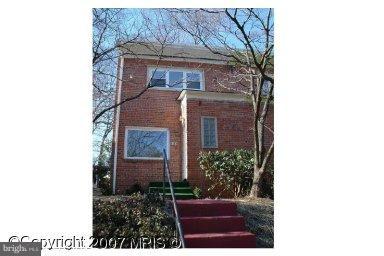 8440 12th Avenue Silver Spring, MD 20903 - Photo 1 of 1 a front view of a house with a garden
