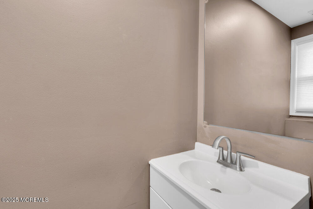 37 Glenbrook Road Freehold, NJ 07728 - Photo 26 of 34 a bathroom with a sink and a mirror