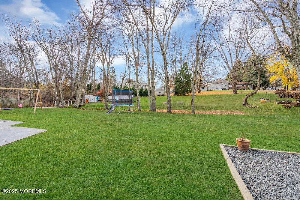 37 Glenbrook Road Freehold, NJ 07728 - Photo 34 of 34 a garden with trees in the background