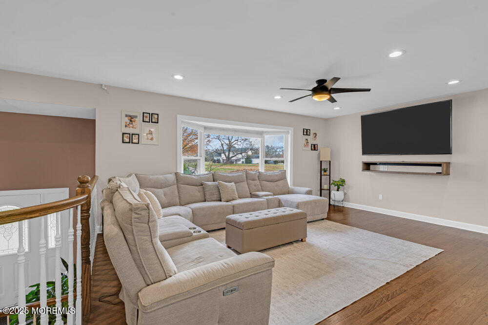 37 Glenbrook Road Freehold, NJ 07728 - Photo 6 of 34 a living room with furniture and a flat screen tv