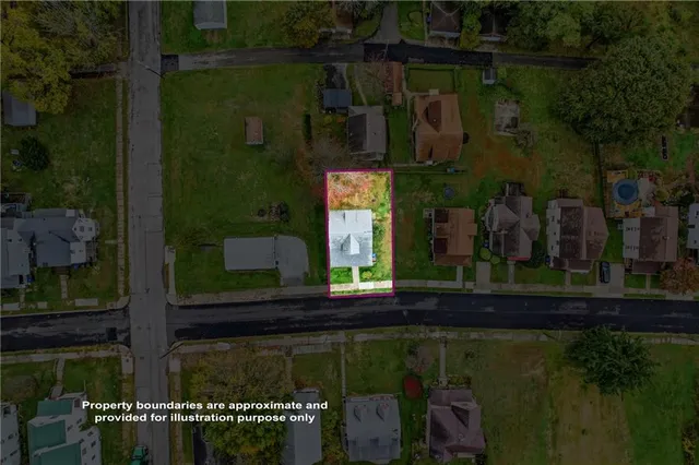 a view of a house with a small yard