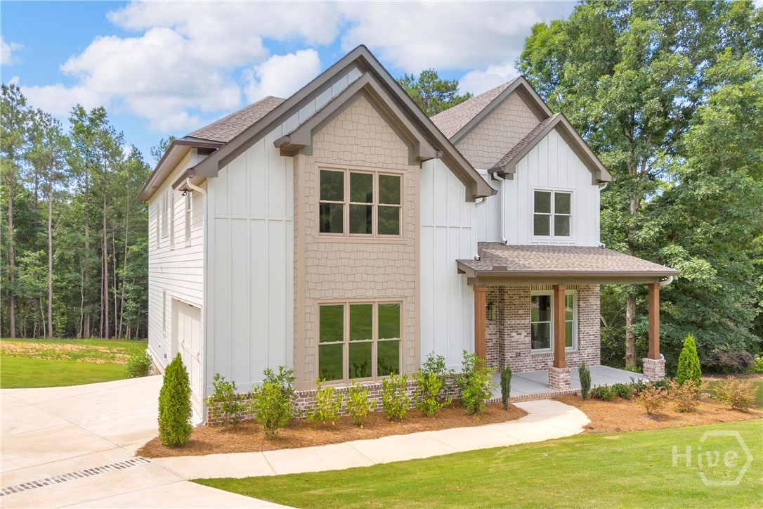 2476 St Martin Way Monroe, GA 30656 - Photo 72 of 75 Craftsman New Construction - two-story residence featuring a covered front porch with stone pillars