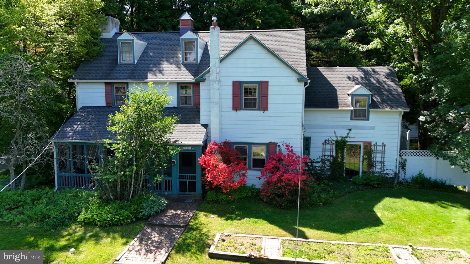 2701 Alden Road Bryn Athyn, PA 19006 - Photo 1 of 105 a front view of a house with garden